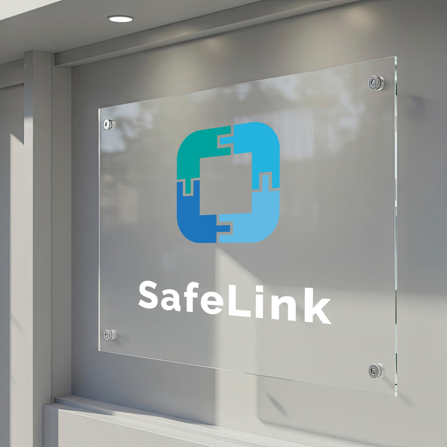 a clear glass sign with a logo and the text &quot;SafeLink&quot; displayed on it.