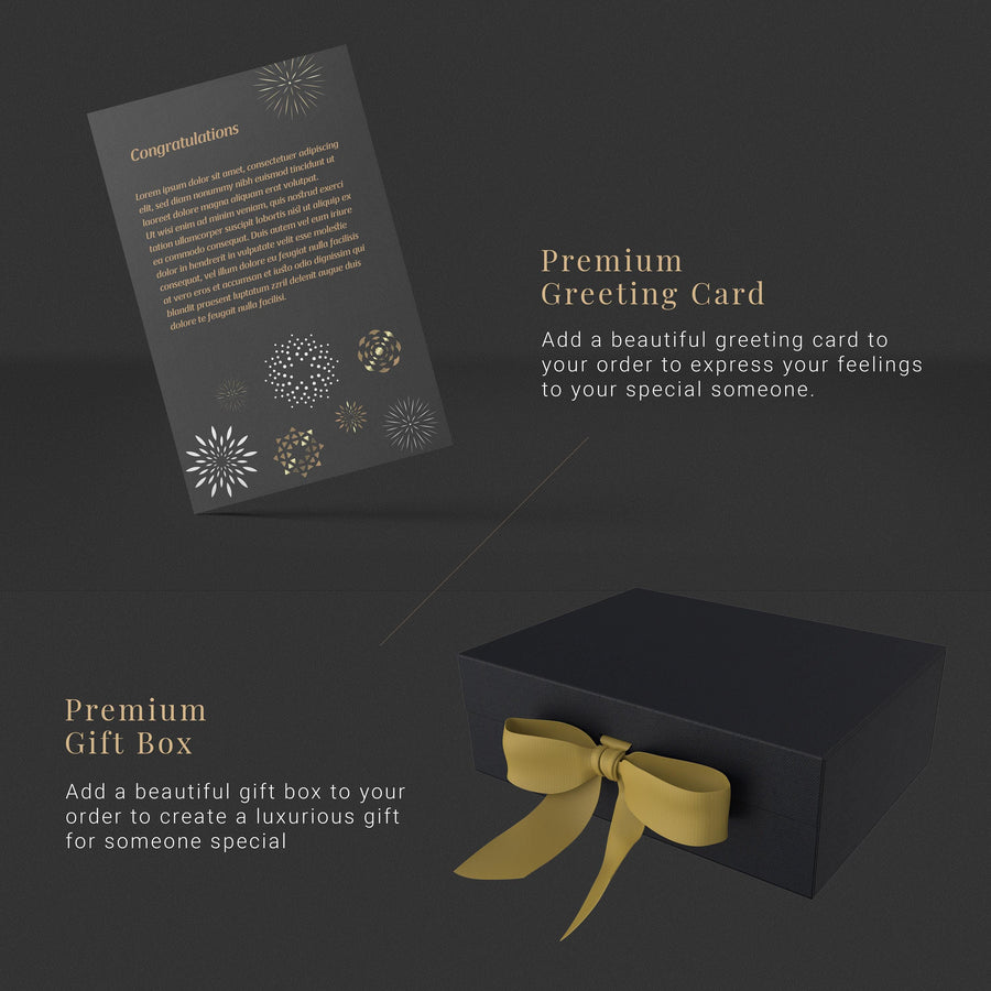 a black box with a gold ribbon and a greeting card
