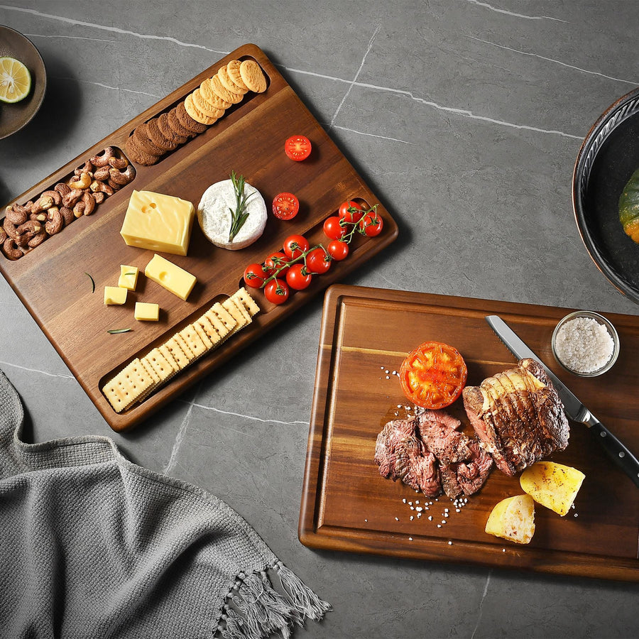 a wooden cutting board topped with meat and cheese