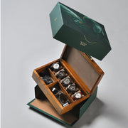 a green box with several watches inside of it