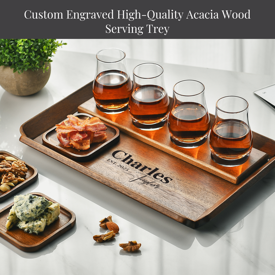 A wooden serving tray with a variety of food items and drinks, including a plate of bacon, a small plate of cheese, and several glasses filled with a dark liquid.