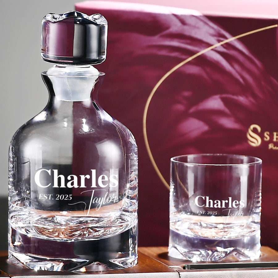 a bottle and a glass sitting on a table