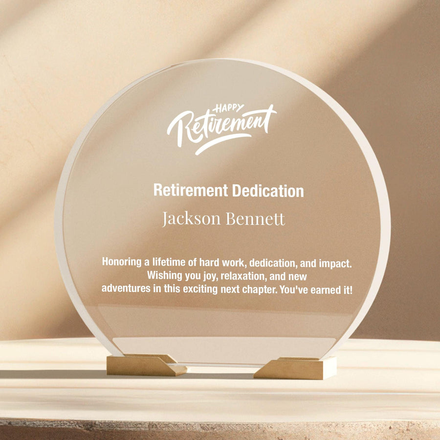 a clear glass award plaque sitting on top of a table