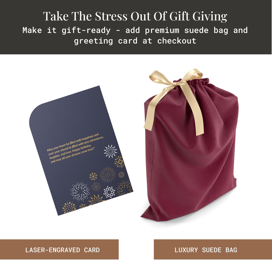 a maroon satin gift bag with a gold ribbon, a black and gold card with a floral design, and a black and gold card with a message about gift-giving.