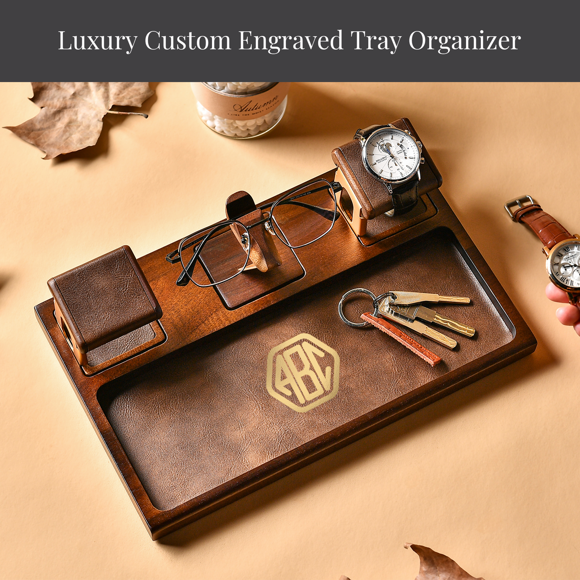 A wooden tray organizer with various accessories, including a watch, glasses, and keys, arranged on a beige background.
