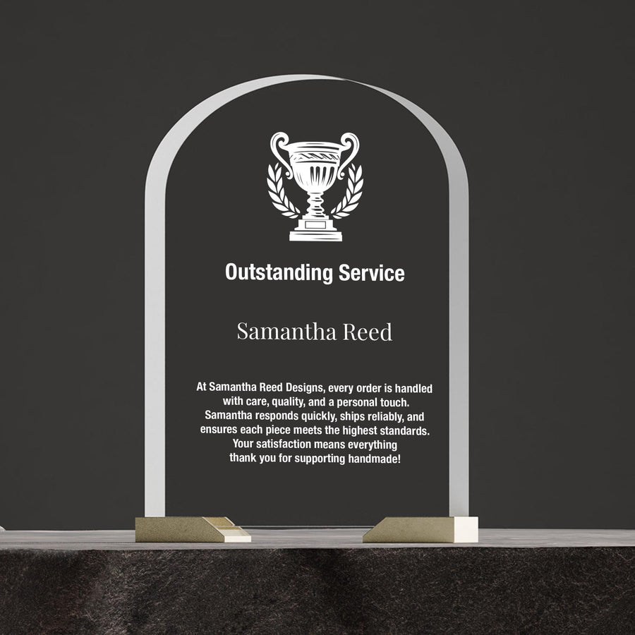 a plaque with a picture of a trophy on it