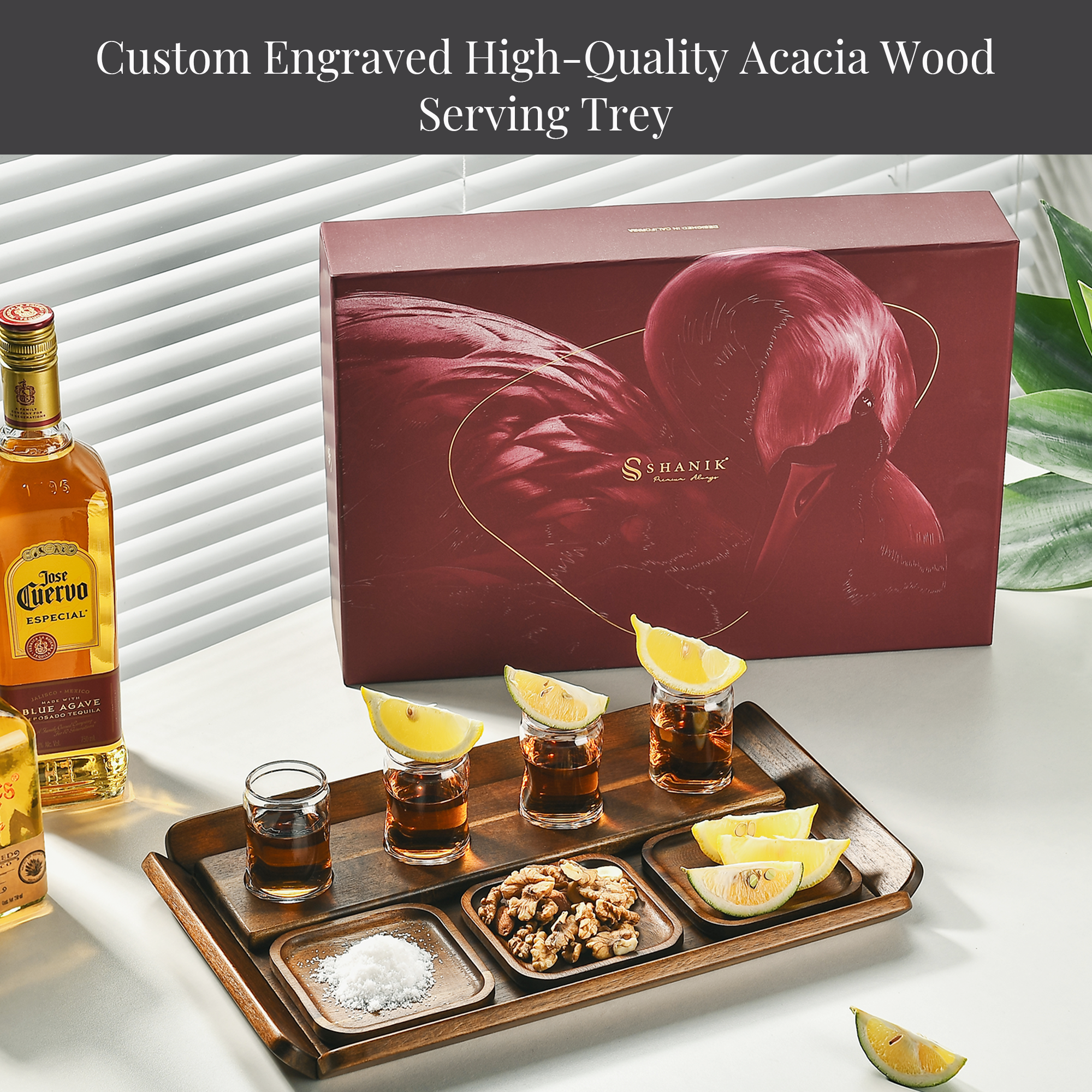 a tray with various shots of tequila, a bottle of Cerveza, and a box of Acacia Wood Serving Tray.