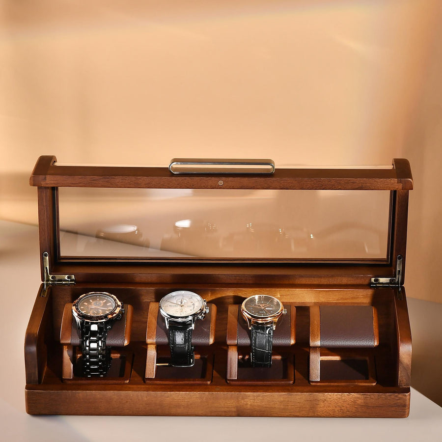 a wooden box with three watches inside of it