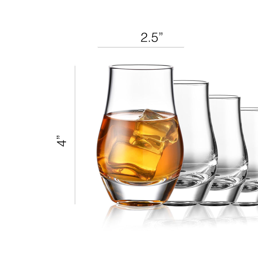 a collection of glassware, including a glass filled with amber-colored liquid and ice cubes, along with several other glasses of varying shapes and sizes.