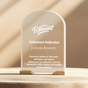 a clear glass award plaque sitting on top of a table