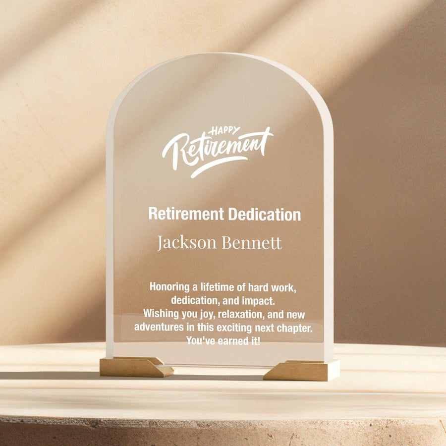 a clear glass award plaque sitting on top of a table